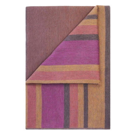 Soft alpaca throw blanket from Shupaca with a canyon-inspired pattern, featuring warm, cozy, natural-toned woven fabric.