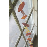 Zen-Zen Capiz shell strand with flame design, showcasing translucent, shimmering shell pieces arranged in a decorative pattern.