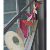 Zen-Zen Capiz Shell Strand in Flame color, showcasing smooth, translucent shell pieces arranged in a decorative strand.