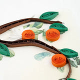Close-up of Quilling Card featuring a detailed cat and orange branch design with intricate paper quilling artwork.