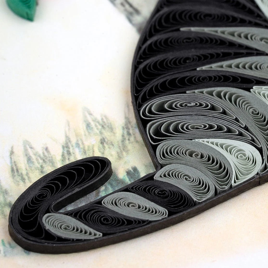 Close-up of a Quilling Card featuring a detailed cat and orange branch design, showcasing intricate paper quilling art.