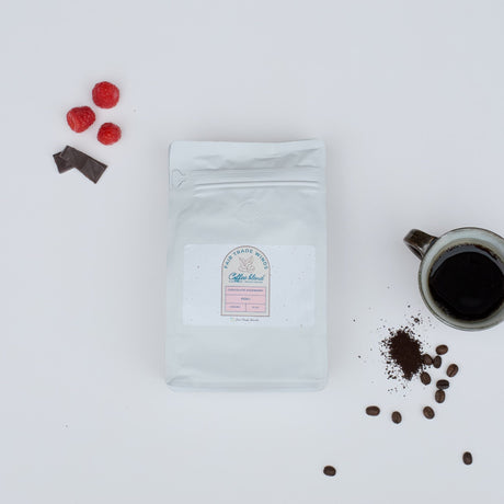 Louisiana Roasting Company Chocolate Raspberry whole bean coffee in a 10 oz bag with rich, flavorful coffee beans visible.