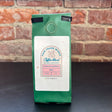 Louisiana Roasting Company Chocolate Raspberry coffee grounds in a 4 oz bag with rich, aromatic texture and vibrant labeling.