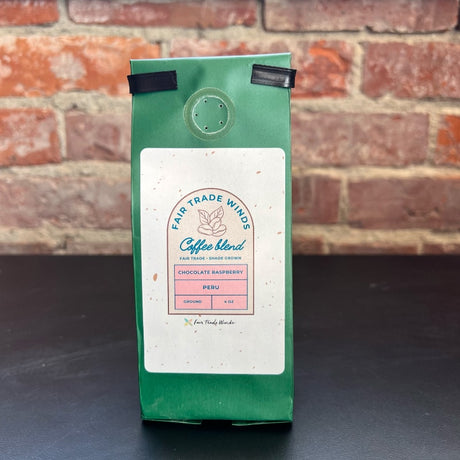 Louisiana Roasting Company Chocolate Raspberry coffee grounds in a 4 oz bag with rich, aromatic texture and vibrant labeling.