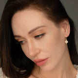 clare opal earrings model