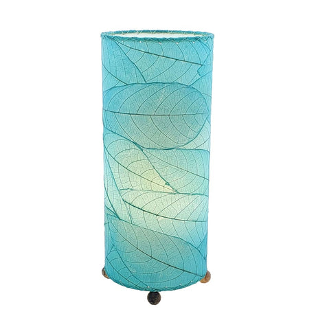 Sea blue Cocoa Leaf Cylinder Leaf Lamp by Eangee featuring a cylindrical design with leaf-shaped cutouts and a warm glow.
