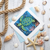 Decorative sea turtle quilling card featuring intricate paper quilling design on a white background.