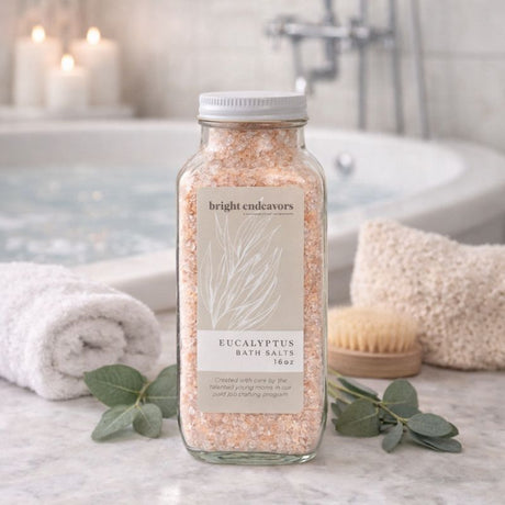 Bright Endeavors eucalyptus bath salts in a 16 oz jar, featuring fresh eucalyptus leaves and mineral-rich salts for relaxing bath experiences.