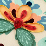 Close-up of a Folk Art Quilling Card by Quilling Card featuring intricate paper flower designs and colorful quilling details.