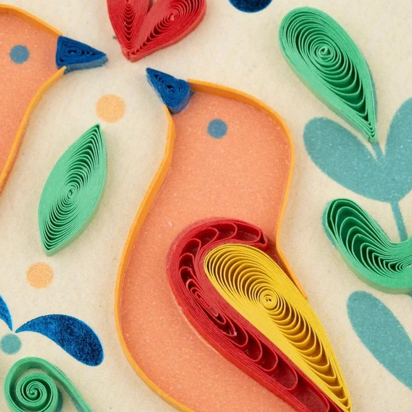 Close-up of a folk art quilling card by Quilling Card featuring intricate paper quilling designs and vibrant colors.