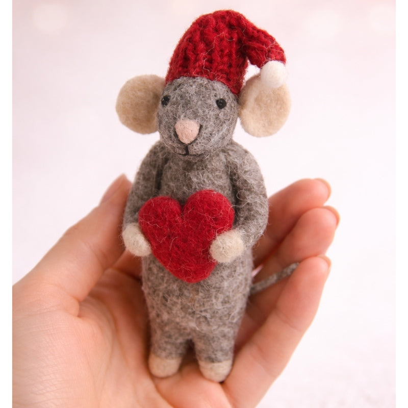 grey mouse heart ornament in hand