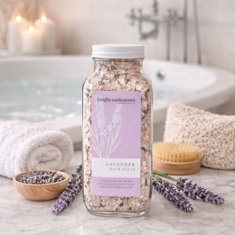 Bright Endeavors lavender bath salts in a 16 oz jar with lavender flowers and salts, perfect for relaxing bath routines.