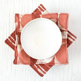 Bowl cozy in mod circle rust pattern, soft fabric cover designed to protect hands from hot bowls.