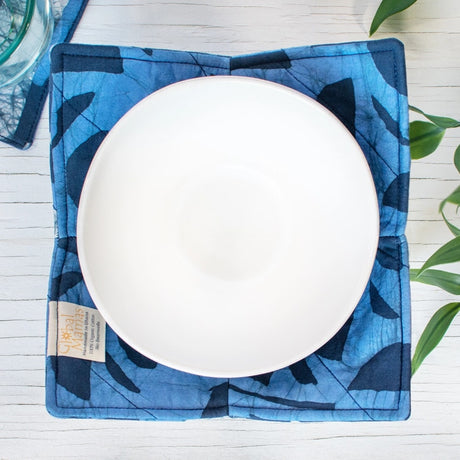Navy Bowl Cozy featuring soft, insulated fabric to protect hands from hot bowls. Durable and stylish kitchen accessory.