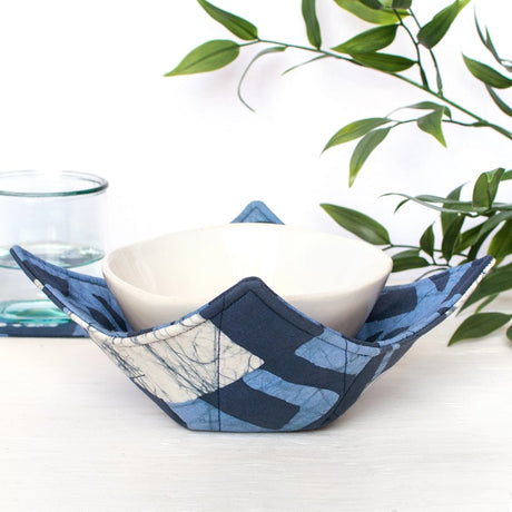 navy bowl cozy with a block print design, made to keep your microwave-safe bowls warm and protected.