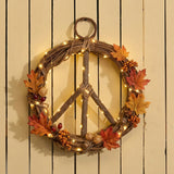 Handmade vine peace wreath with woven green vines and decorative accents, crafted by Serrv for a natural, artisanal look.