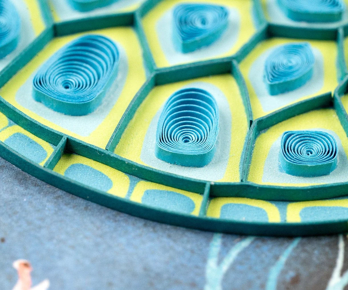 Decorative sea turtle quilling card featuring intricate paper quilling art, perfect for greeting or special occasions.