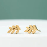 rowen leaf studs frosted gold close