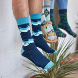 socks that protect oceans waves teal model