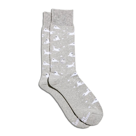 Pair of Conscious Step socks featuring seal protection design, made to raise awareness and support seal conservation efforts.