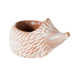 Ceramic hedgehog-shaped planter on a white background
