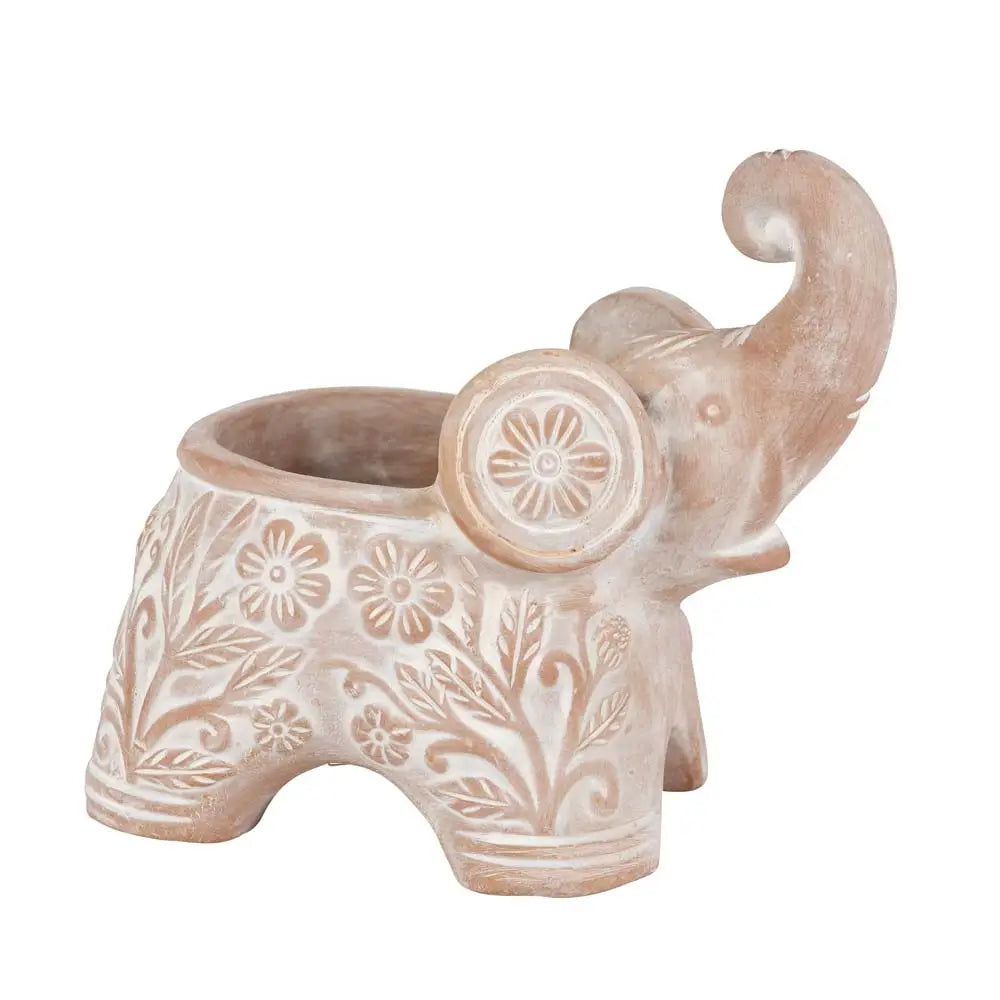 Ceramic elephant planter with floral patterns on a white background