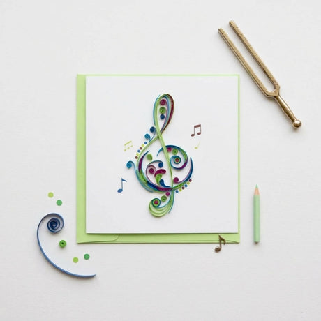 Blue treble clef quilling card featuring intricate paper filigree art, perfect for musical or artistic occasions.